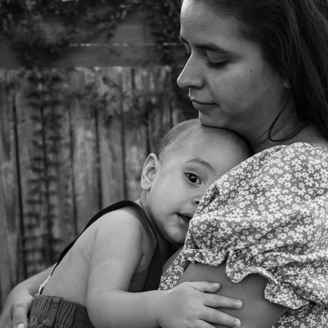 A mother holding her baby son